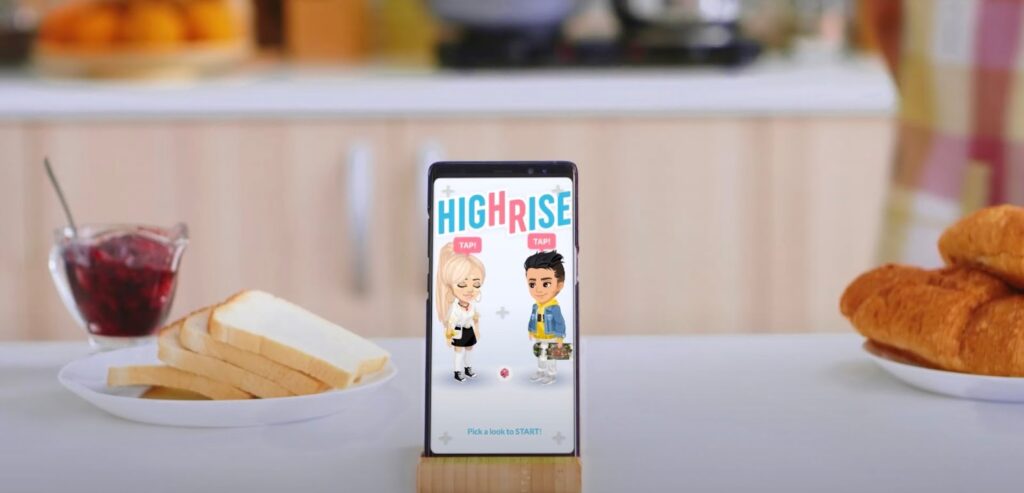 Highrise game on a phone standing on a table