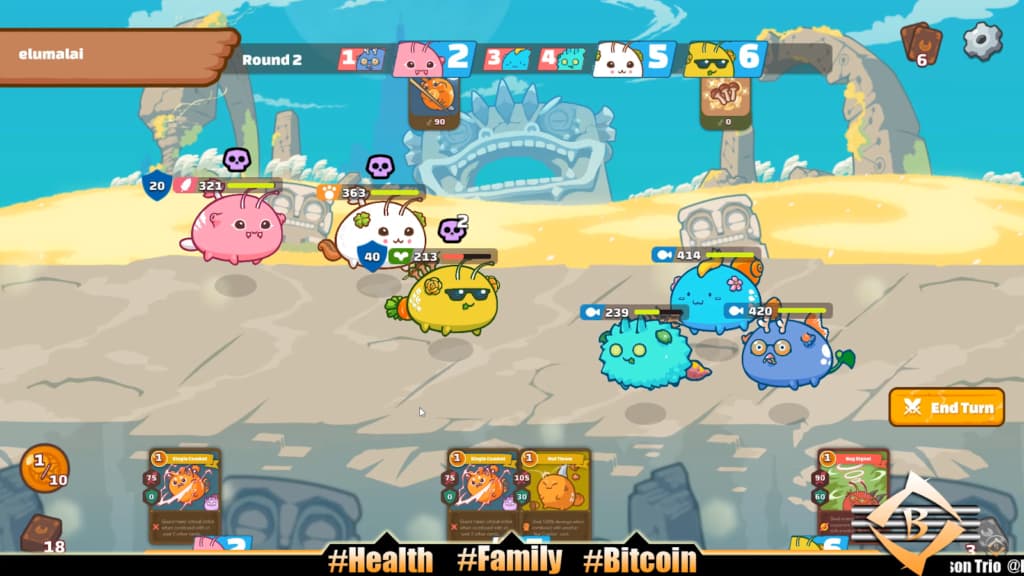 Animated creatures battle on a sandy arena in a turn-based game interface